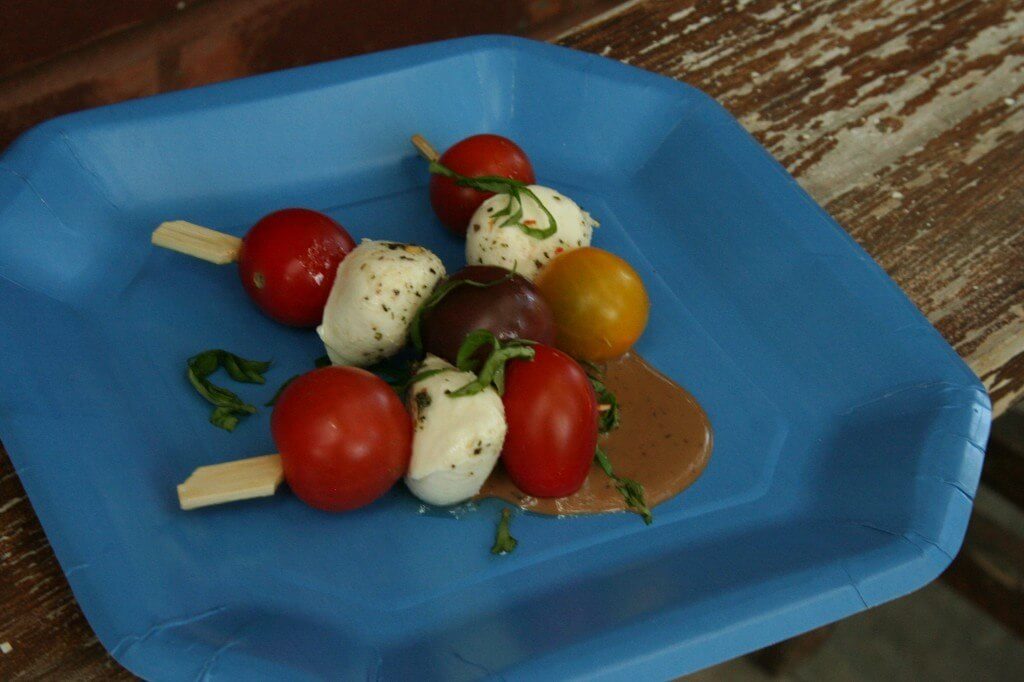 IMG_7799 Tomato Mozzarella Skewers with vinaigrette. What could be easier for an appetizer or side? Add a blue plate for 4th of July perfection!