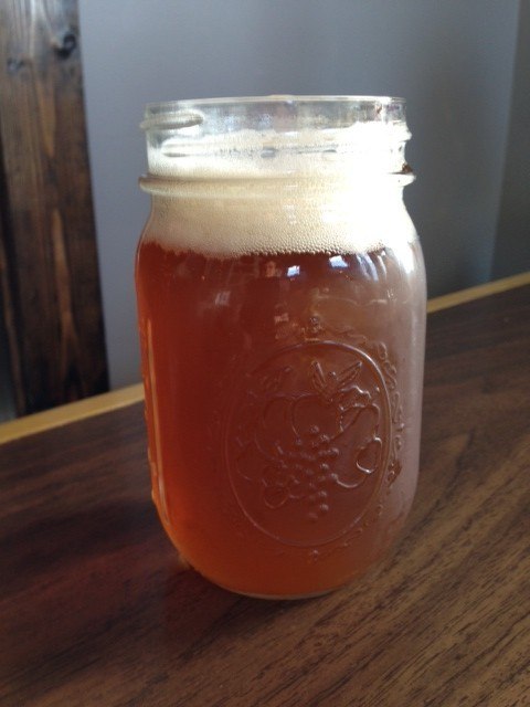 A cold one arrives just in time in a frosty mason jar.