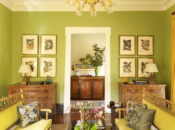 The pair of commodes were purchased at the Antiques and Garden Show of Nashville. The pillows made of a vintage chintz pattern from George Le Manach complement the scheme. The painting seen through the doorway is by William Dunlap.