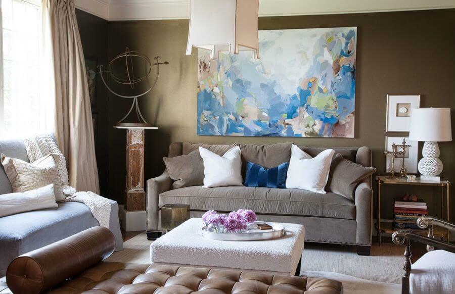 Our living room has lots of seating. My husband, Mark, jokes that I collect old chairs. This incredible painting by Christina Baker brings the room to life. Her use of color is breathtaking.