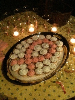 Cupcakes arranged in the shape of a breast cancer awareness ribbon.