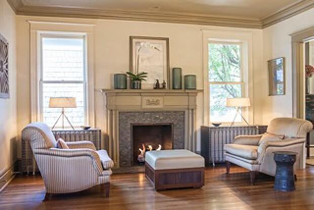 Jeff's recent additions to his living room: steel radiator covers, which double as sideboard tables in the windows, and a custom mahogany tambour ottoman. Photo credit for two images above: Jennifer Saltsman (All other images of today's home were taken by Julie Wage Ross.)
