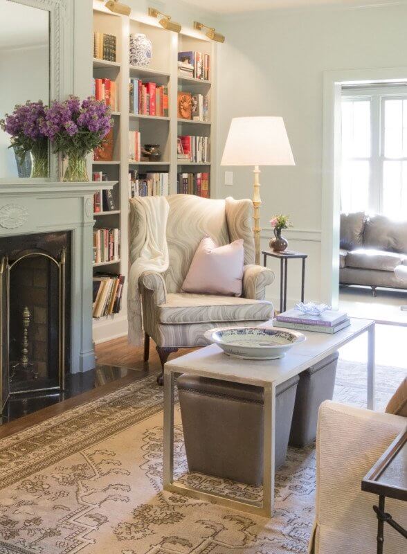 This wingback chair, another key focal point in the room, is a treasured memento from the wife's aunt. The couple wanted to keep it as part of the design plan, and it lives on here reupholstered in an incredible Kelly Wearstler fabric. Divine!