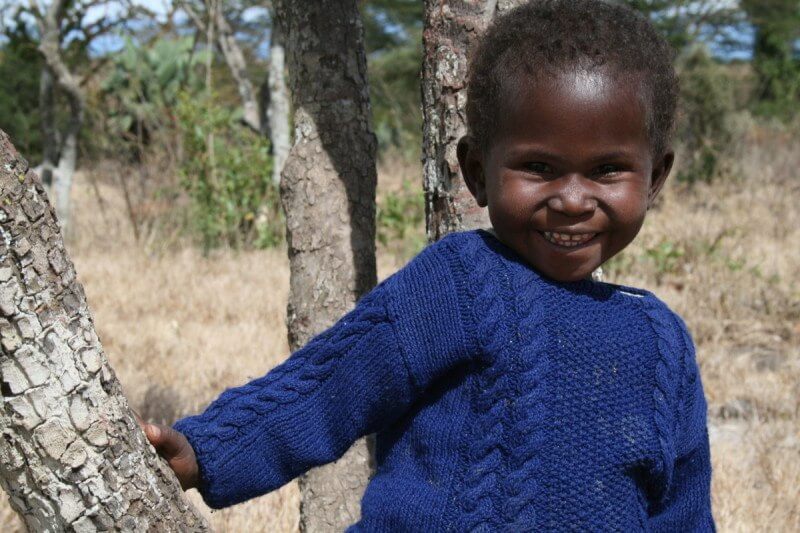 This little girl in the blue sweater inspired Sarah to focus on agricultural development. "I hated that this little girl could not eat, but I knew, the only way to sustainably fix this problem was to equip her parents to do it."