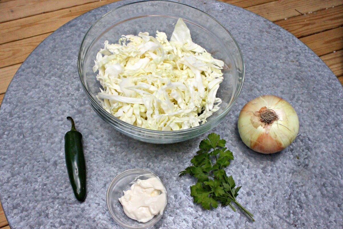 Spicy Cookout Coleslaw brings bold flavors with the addition of jalapeño and Vidalia onion.