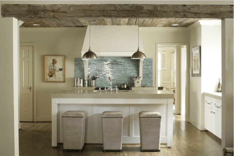 Blue tile backsplash adds interest to a neutral toned kitchen.