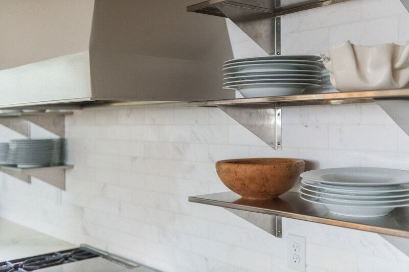 Jennifer found these stainless steel shelves at a local restaurant supply store. Christopher Architecture and Interiors