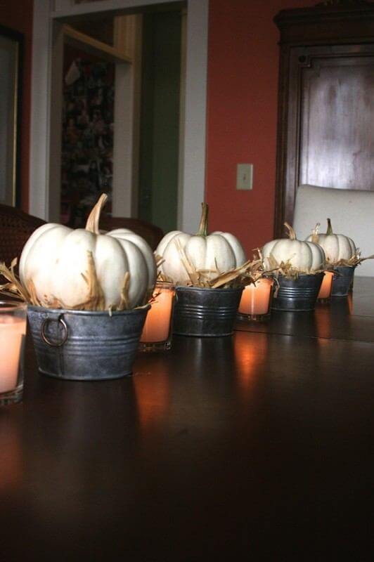 white baby pumpkins with straw 3
