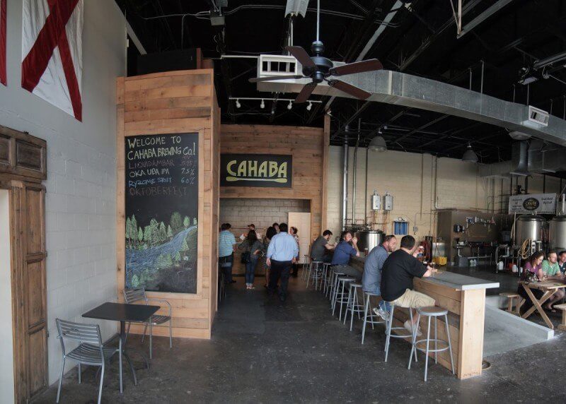 Cahaba Brewing has a large tasting room with a cool industrial vibe. Image credit: onboardthegravytrain