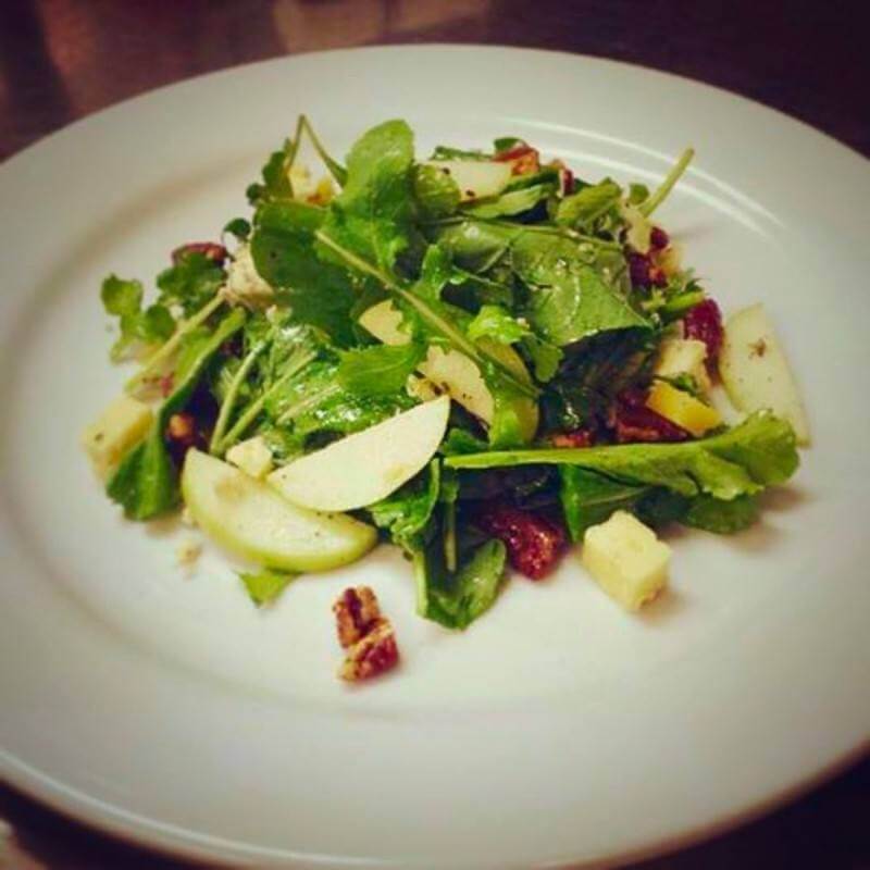Fresh greens simply dressed with seasonal additions make for the perfect starter.