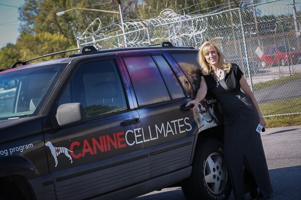 Susan Jacobs-Meadows with the Canine Cellmates truck.