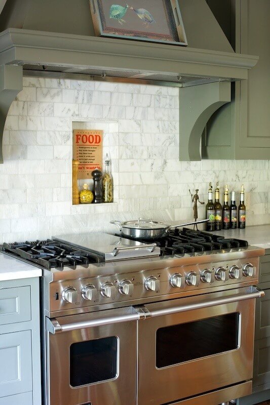 A heavy duty double oven range with six burners and a griddle ensures the chef can feed a crowd. 