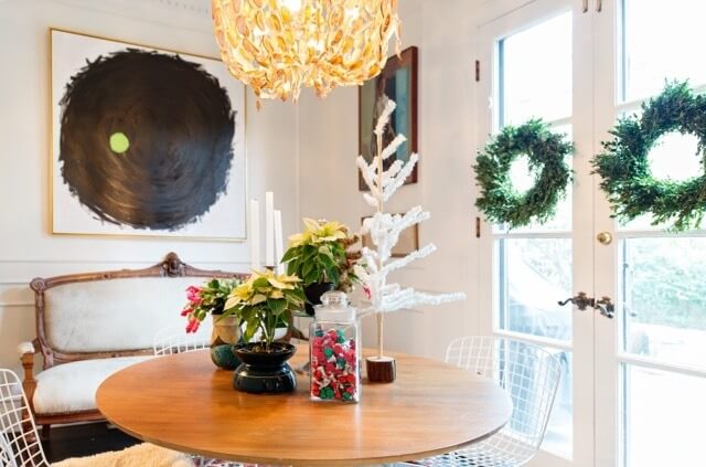 The breakfast room is right off the kitchen. The holiday addition of boxwood wreaths and poinsettias makes for perfection. Note the white tree as well! 