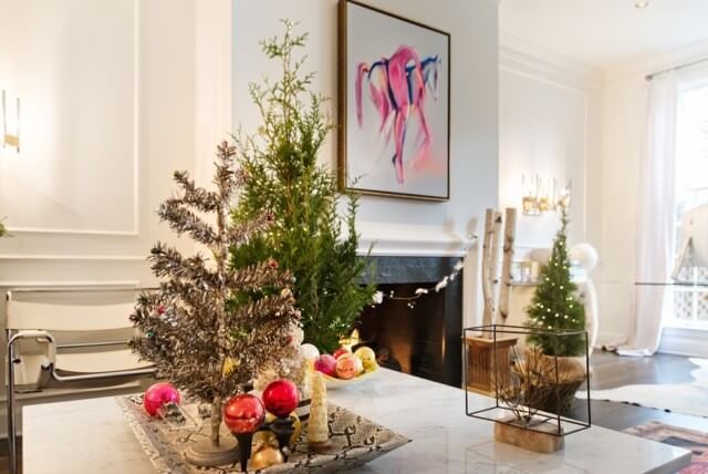 Trees, trees, trees! You don't have to deck out each tree with ornaments ... the ornaments in the living room/study are found in bowls and make great pops of color.