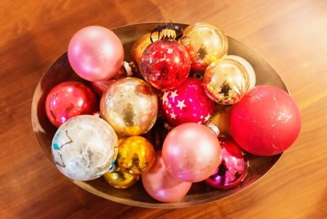 Just like in the living room, the family room has a bowl of vintage ornaments for a splash of color.