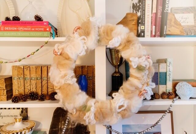 Not all wreaths in the house are made from boxwood! And, look at the little garland strings and pinecones!