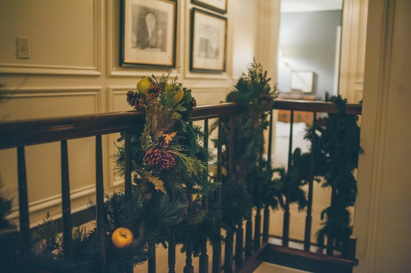 Gorgeous garland on the stairwell. These tips walk you through how to throw a perfectly elegant holiday party!