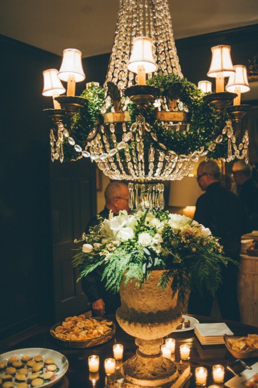 Wreaths IN the chandelier! These tips walk you through how to throw a perfectly elegant holiday party!