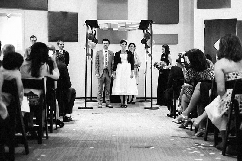 The wedding ceremony was held inside the STAX recording studio. The chuppah fabric for the ceremony was custom-made from a graphic of their invitations. | Photo courtesy of Southern Event Planners | Photo credit: Josh Malahy
