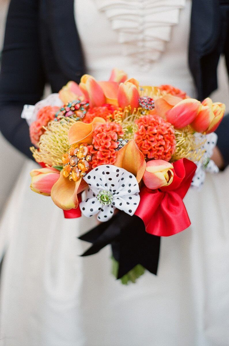 Instead of flowers, Angela made the bouquets with a collection of brooches. | Photo courtesy of Southern Event Planners | Photo credit: Josh Malahy