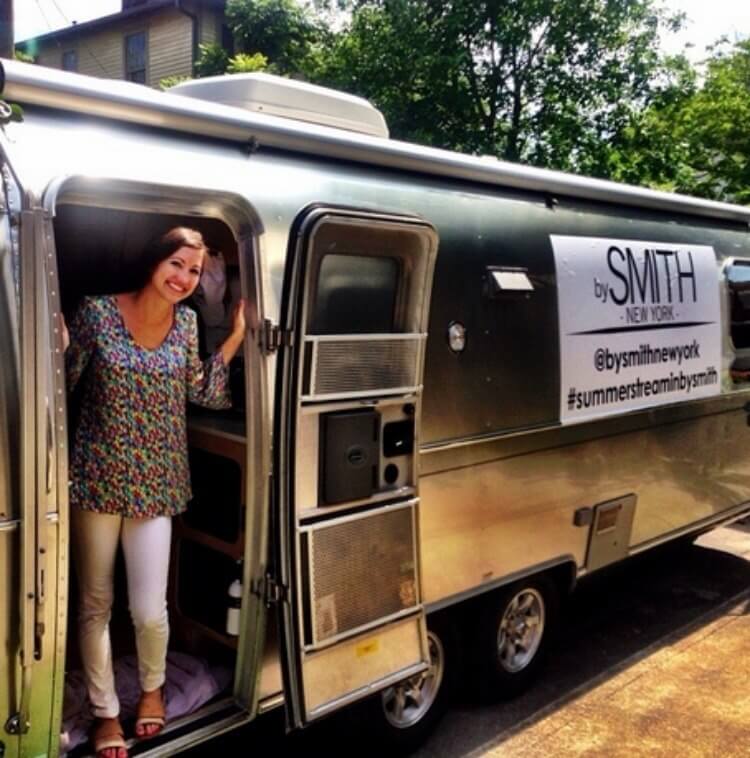 Smith Sinrod peeks out of her signature bySMITH Airstream trailer and mobile trunk show. 