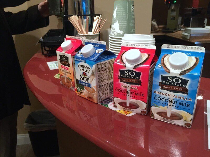 The coffee station at Vegan Vee has fair trade coffee and coconut milk and soy milk options for creamer.