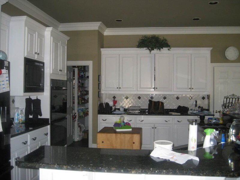 This is the before shot of a kitchen that was renovated by Crowell + Co. Interiors.