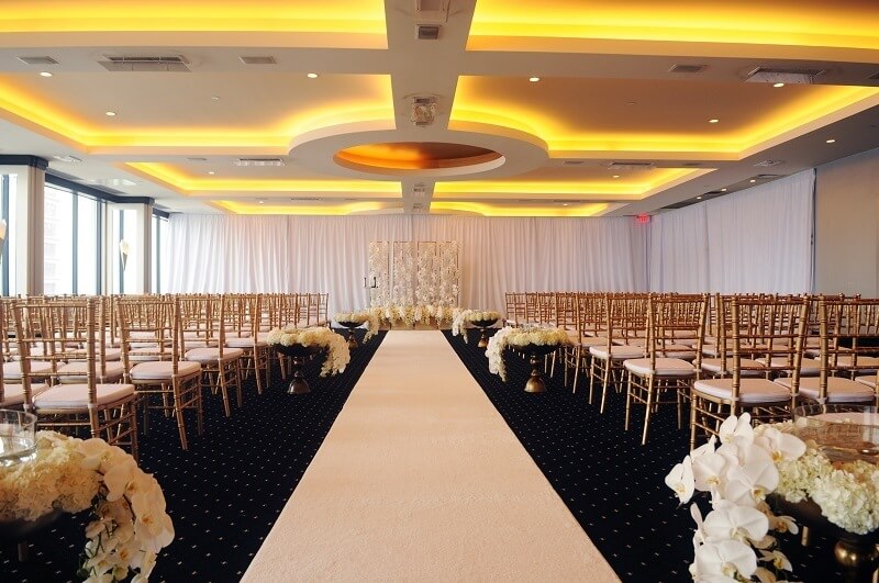 Hometown NBA Star marries in Louisville in a lavish wedding. The ceremony took place at the Waterford Room at the Galt House. All chandeliers were removed from this room to accommodate the height of the wedding party. Over 450 orchids are in this room as well.