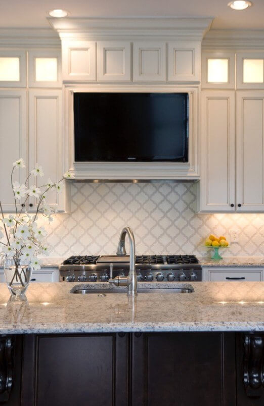 The tv fits seamlessly into the design of this renovated kitchen!