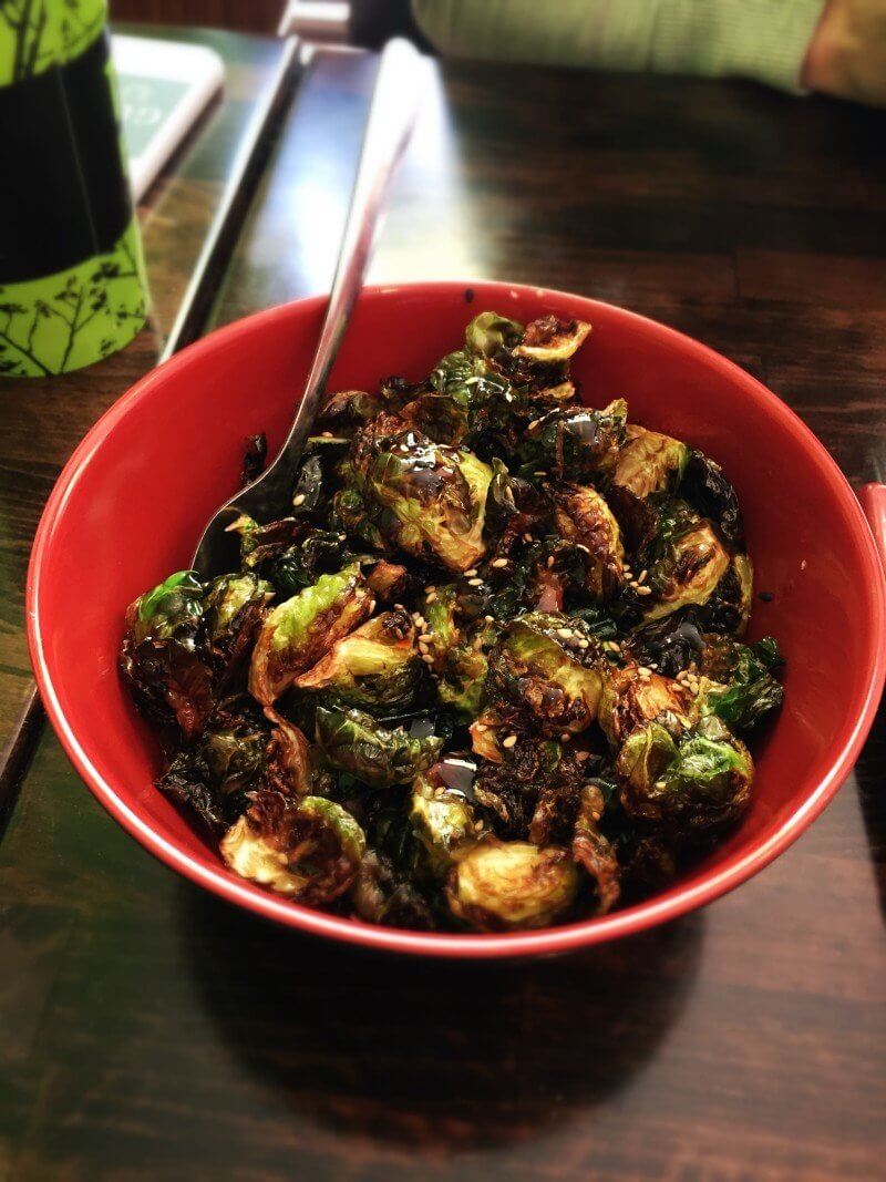 Crispy Brussells sprouts served over your choice of brown or white rice will convert anyone who thinks they don't like this vegetable!