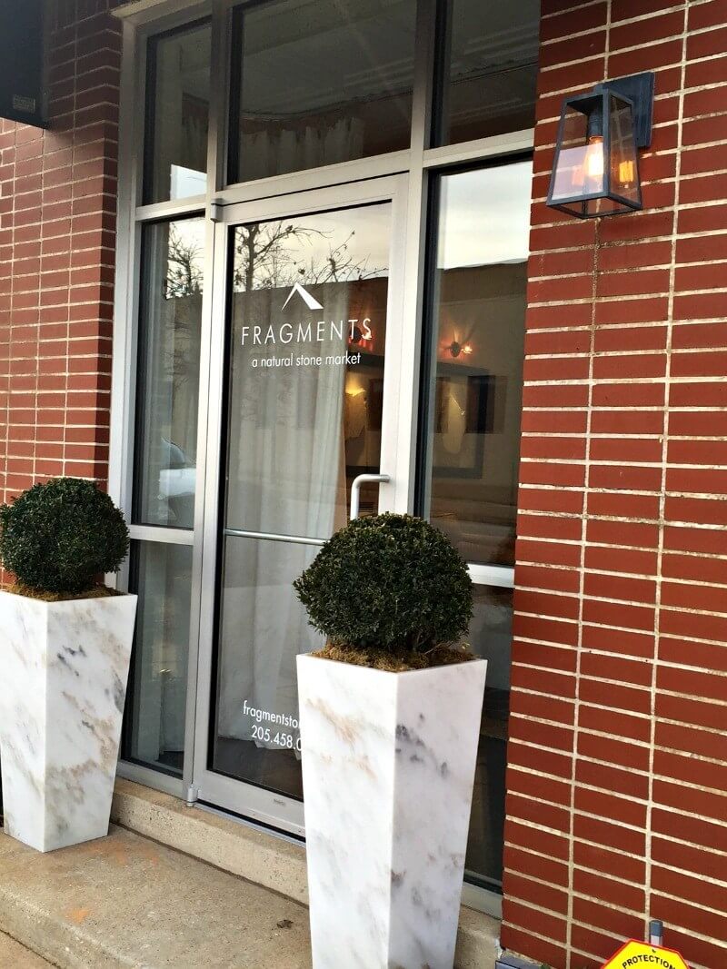The entrance to Fragments showcases a pair of marble planters they fabricated.