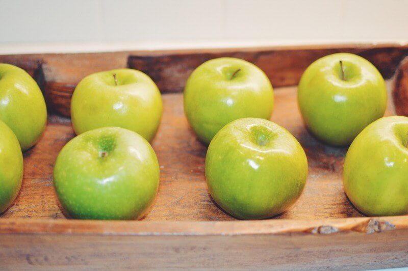 A tray of green apples provides a fresh look.