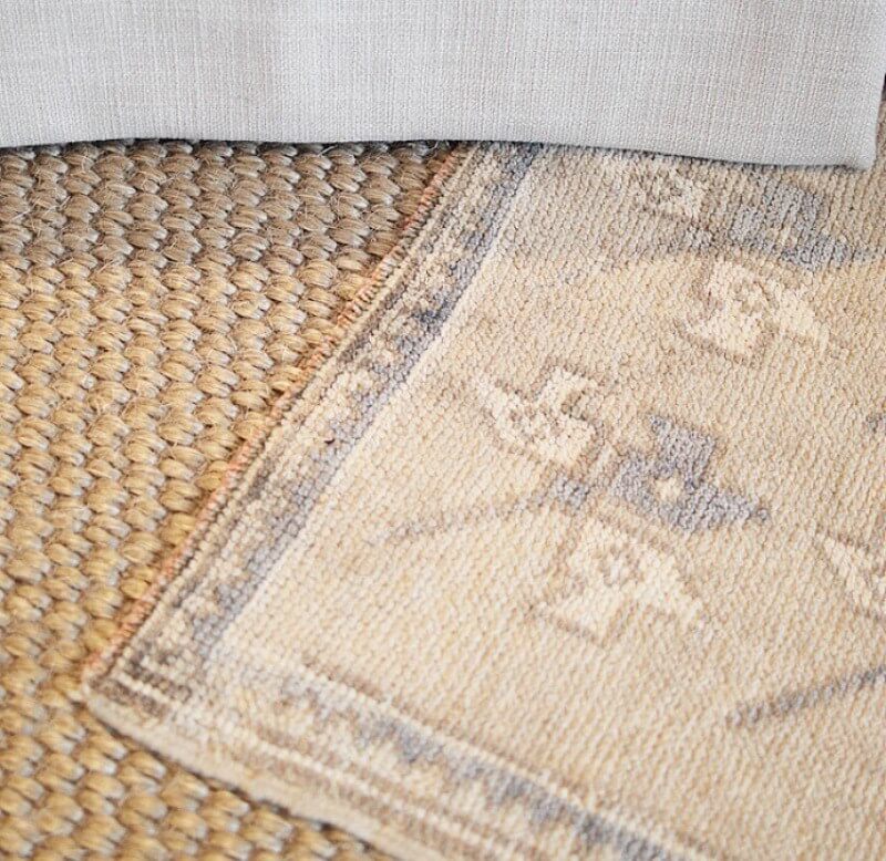 Layering rugs is very on trend and a great way to spruce up a room.