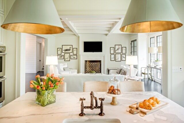 The kitchen opens directly to the den, creating a large, open space perfect for entertaining. 