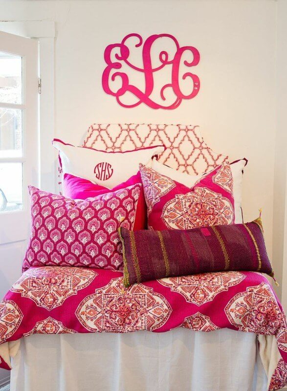 Bedding by Room 422 brightens up an otherwise drab dorm room. (Prices range from $48 for a lumbar pillow to $170 for a leather headboard.)