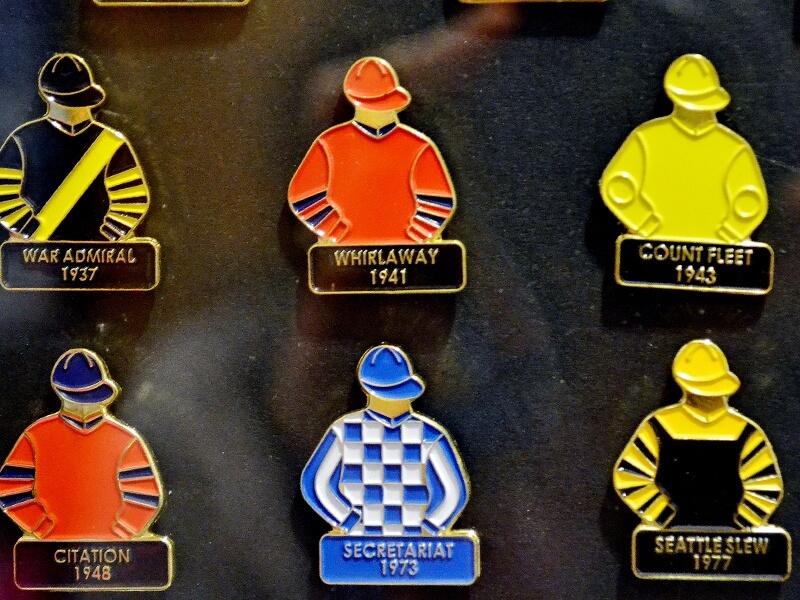 Kentucky Derby Museum Gift Shop for Derby Shopping:Jockey pins for all the winners since 1875.