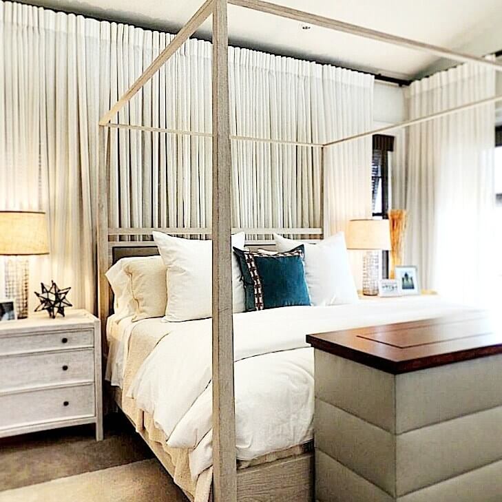Chad James entire room is dressed in soft whites and grays, which reflects light around the space.
