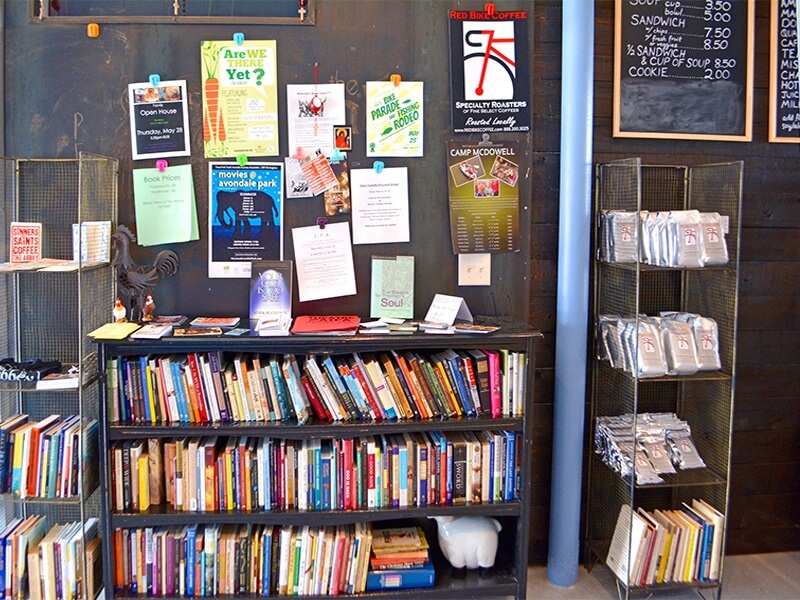 Donated books for sale along with Red Bike Coffee - local coffee from Irondale that they roast at The Abbey