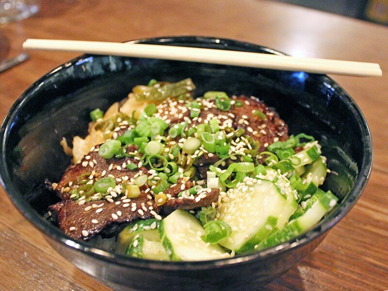 An unexpected dish is perfect to your pallet; ginger marinated beef short ribs with soy and sesame sticky rice, cucumber salad and kimchee.