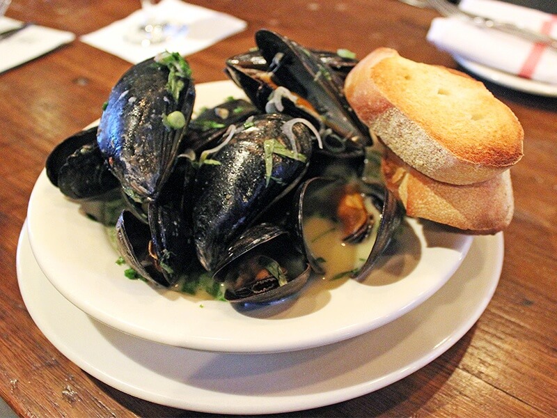 Mussels remain on the menu most of the year, and it’s a good thing they do, because the broth alone will have you dreaming of it in your sleep.