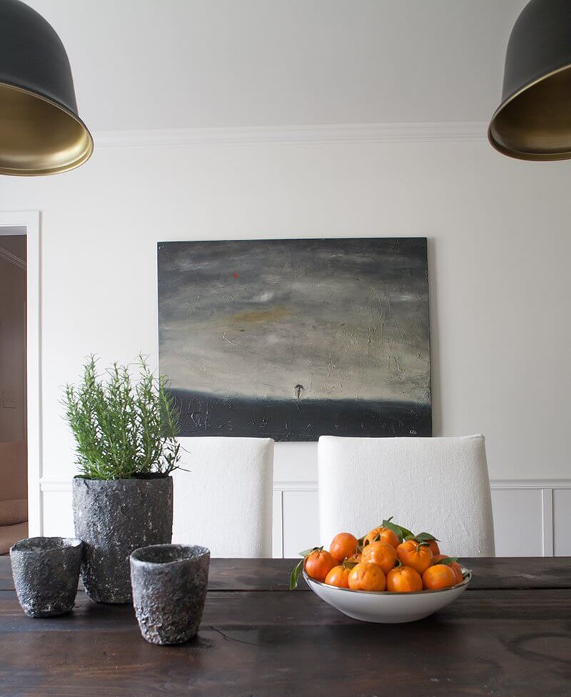 A painting by LA-based artist Mark Acitelli, "Isolation," adds to the relaxed mood of this casual dining area.