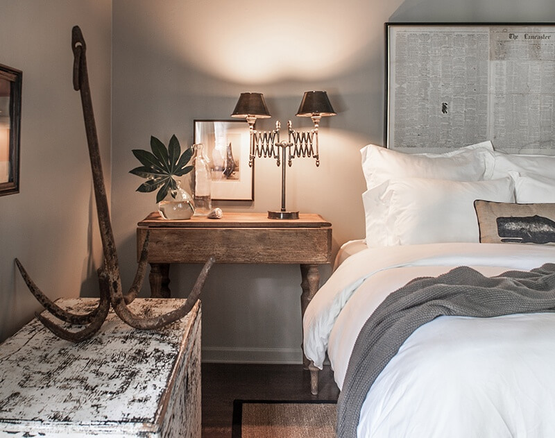 An aged anchor is repurposed as a decorative object in this guest bedroom. Sean has always loved of all things nautical.