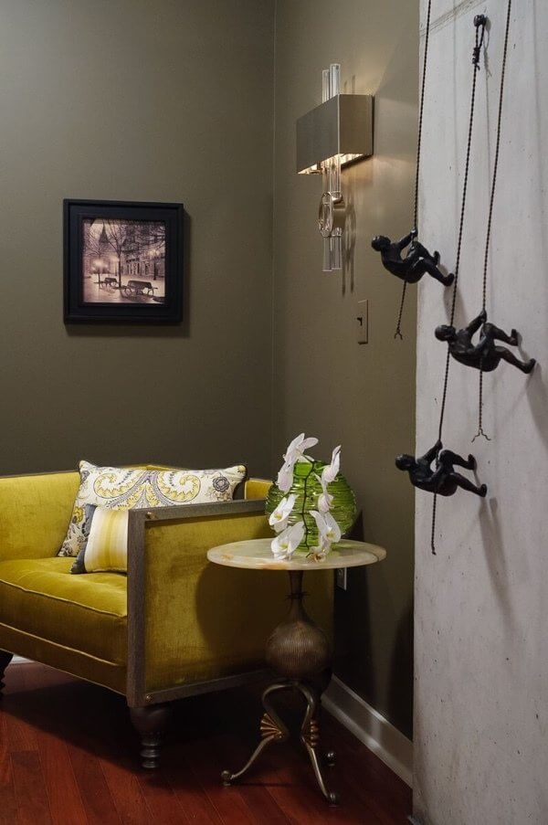Rich colors and a playful wall sculpture greet guests in the foyer.