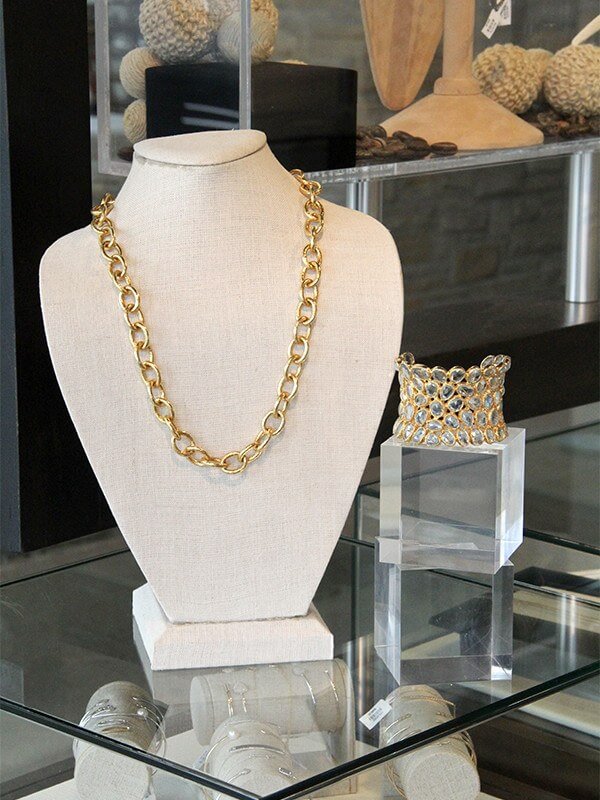 This gold chain and cuff from Anatra would pair perfectly with any color of dress!