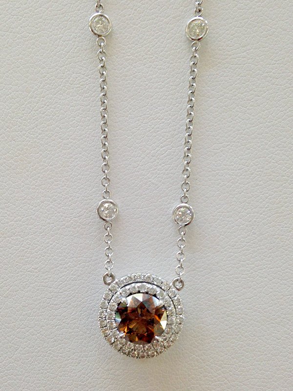 This necklace, created by Cindi Earl, adds emphasis to the birthstone.