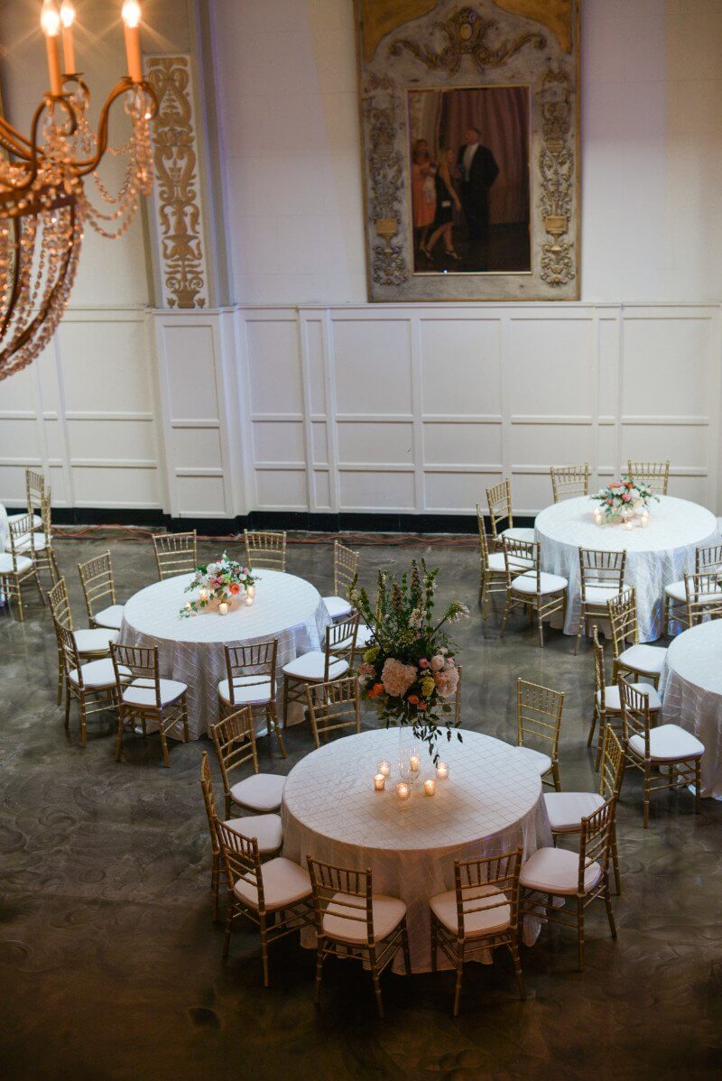 A view of wedding reception tables from the upstairs balcony of The Cadre Building