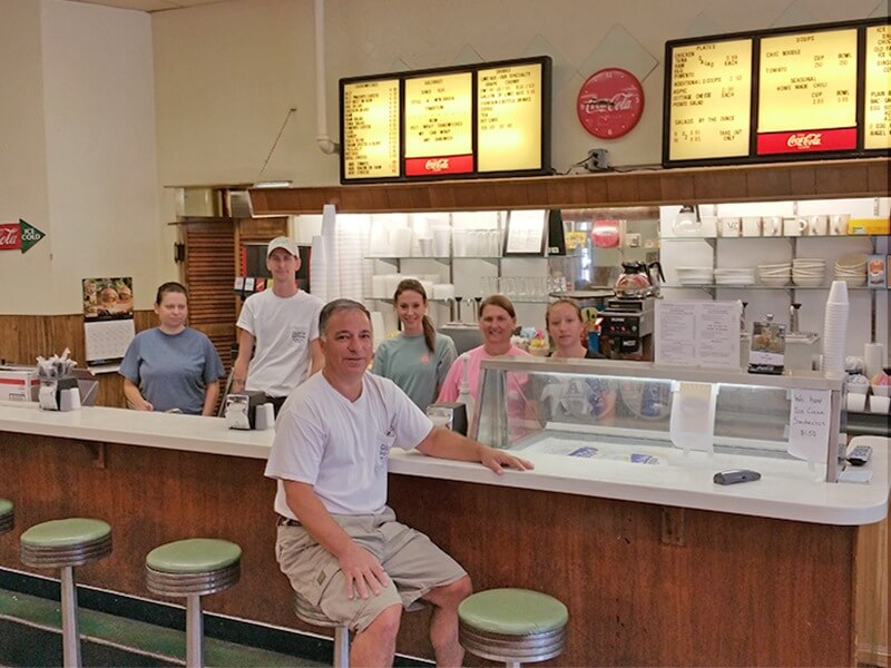 Owner Leon Rosato and the staff of Gilchrist in Mountain Brook, AL