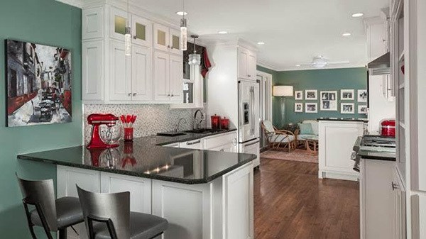 Spontaneous bursts of color add modern appeal in a kitchen and seating area by Trace Ventures