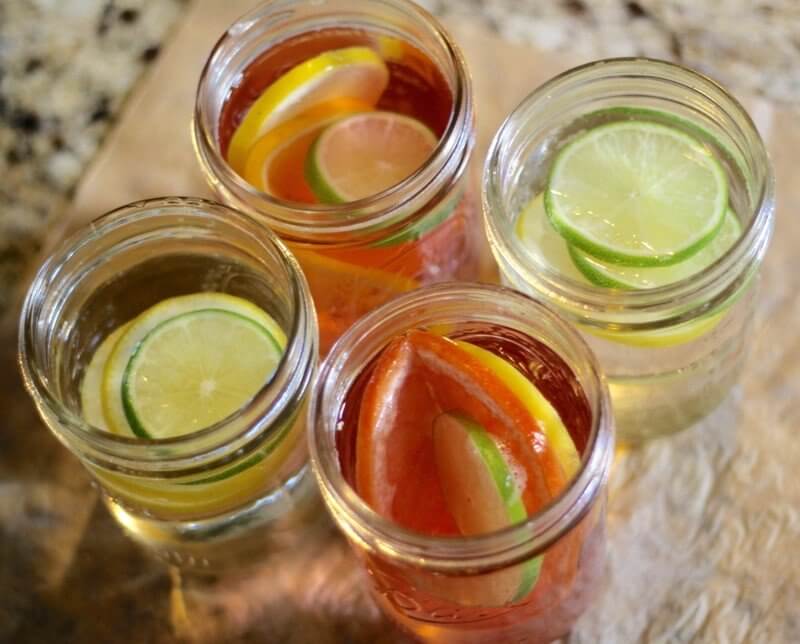 Fruit water: Here you can see the frozen fruit floating. Not only does it add more of a chill to the water, it infuses it with citrus flavors far faster than non-frozen citrus slices do. Instead of ice, chill your water with these frozen delights.