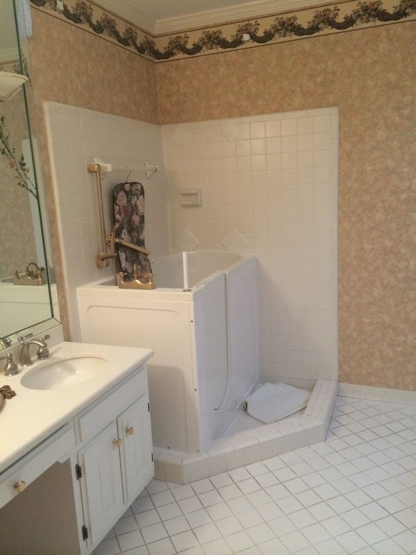 BEFORE: This bathroom is outdated and colorless.